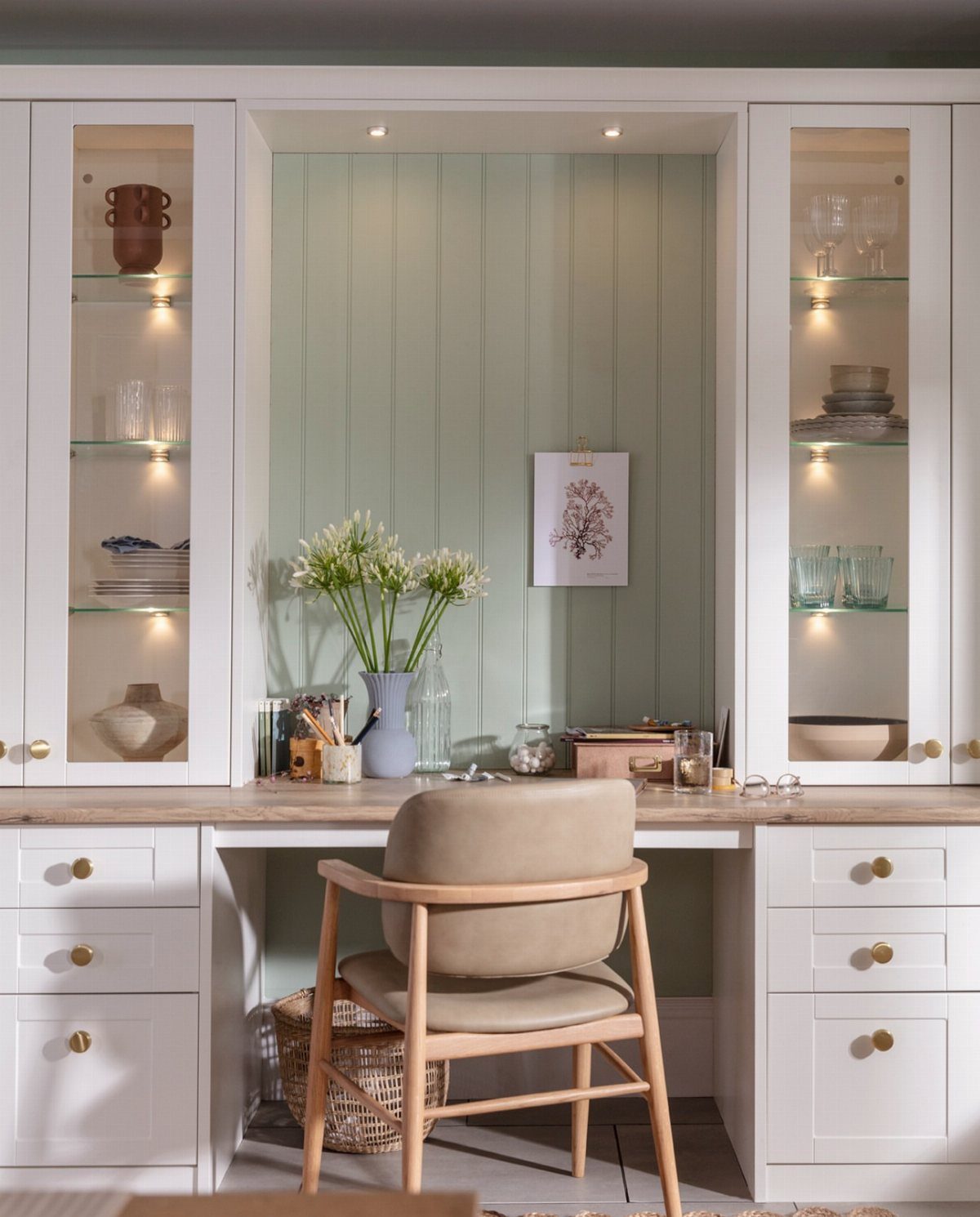 Adding Cabinets to Kitchen: 6 Ways to Gain Storage and Style 6 Built-in white kitchen cabinets configured as a home office desk with a wooden countertop and chair.