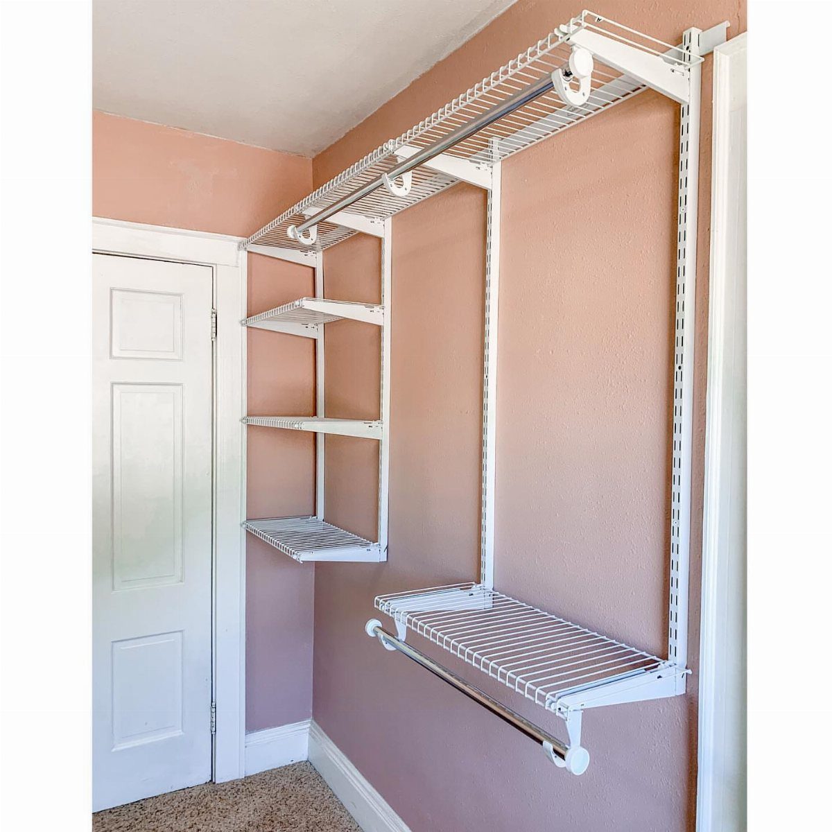 5 DIY Closet Upgrade Ideas Using Popular Wall and Modular Systems 1 White wire closet organizer system with shelves and hanging rods installed on a peach wall.