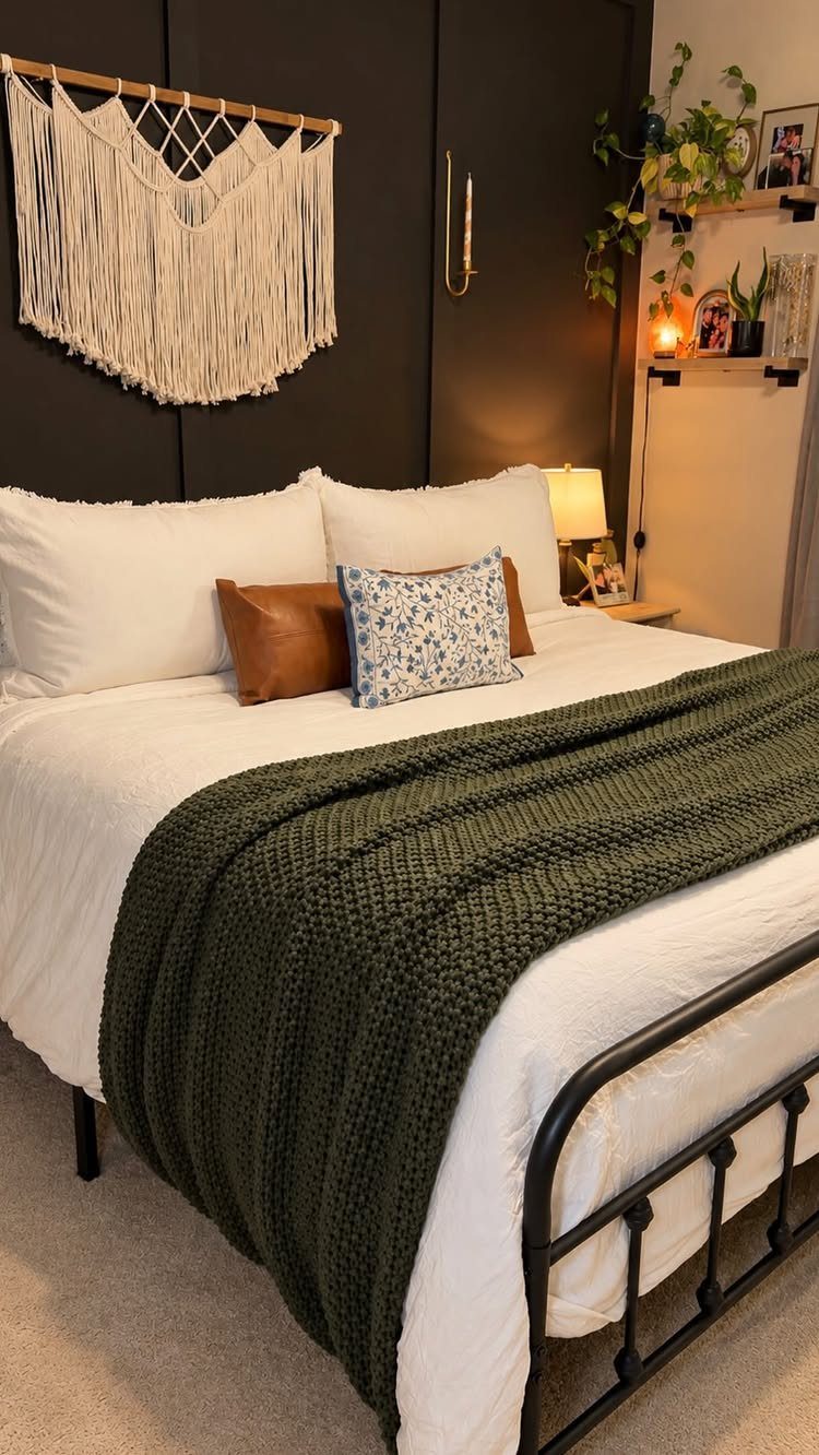 How to Deep Clean New Apartment: 5 Room-by-Room Moves 2 A neatly made bed with white linens, decorative pillows, and a green textured throw blanket.