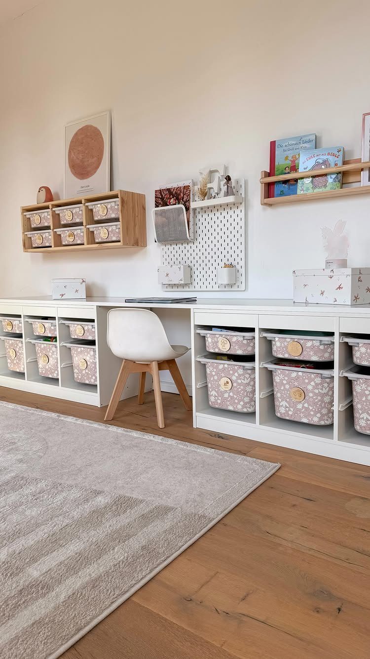 6 IKEA Kids Furniture Hacks for Better Bedrooms 1 White TROFAST storage units with patterned bins and a desk in a bright playroom.