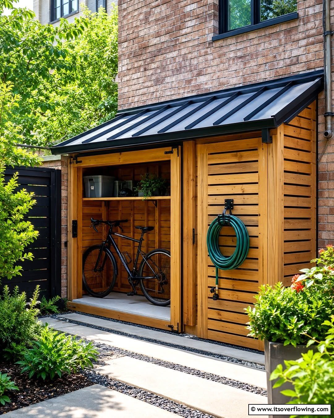 8 Lean-To Shed Ideas for Storage, Parking and Backyard Layouts 1 A wooden lean-to shed attached to a brick house storing a bicycle and garden hose.