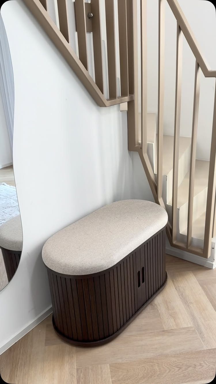 Mid Century Modern Entryway Bench With Storage: 8 Ideas 5 Dark wood fluted storage bench with a beige cushioned top placed near a staircase.
