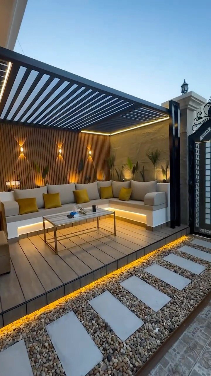 28 Outdoor Wooden Deck Ideas for Any Yard Size 18 Modern outdoor deck with built-in seating and warm integrated LED lighting features.