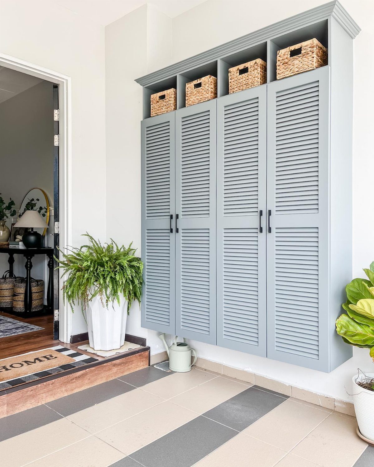 Shoe Storage Tall Cabinet: 6 Ideas for Hallways and Closets 5 A tall light blue louvered door shoe cabinet with wicker baskets in top cubbies.