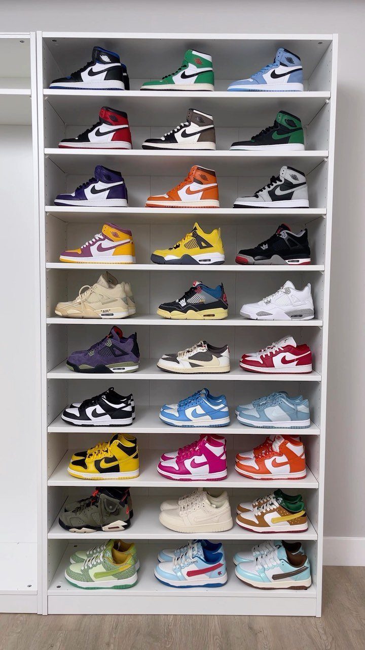 Small Sneaker Collection Closet: 5 Space-Smart Setups 4 A white shelving unit displaying a large collection of colorful high-top sneakers on multiple levels.