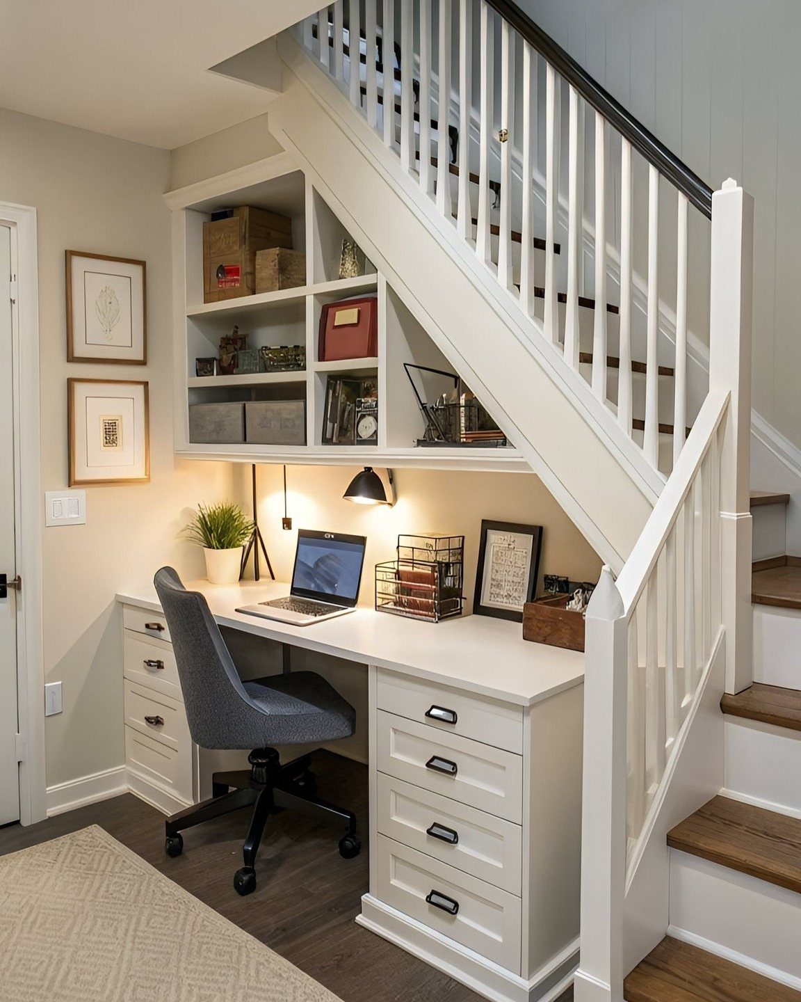 18 Under Stair Storage Design Modern Ideas for Every Home 6 A compact white desk and grey chair set up as a home office under stairs.