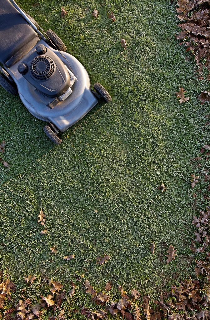 A lawn mower positioned low for the last cut of the season.